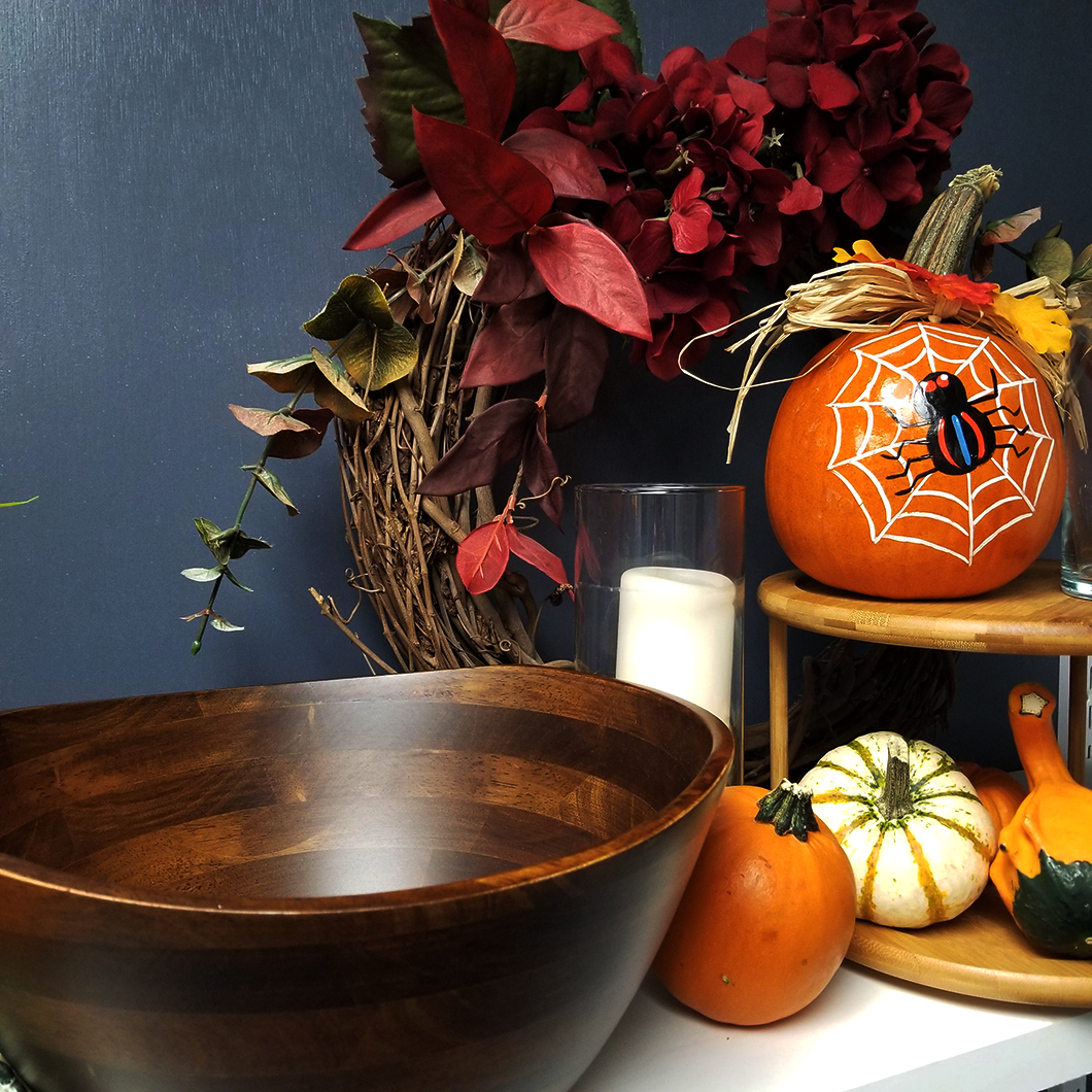 Large Wavy Rim Bowl in Walnut Finish from Lipper International with a Fall wreath and pumpkins in the background